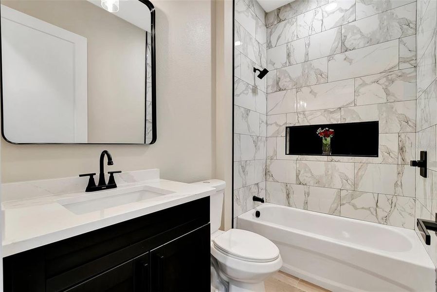 2nd bathroom with convenient accent nook for bathing items