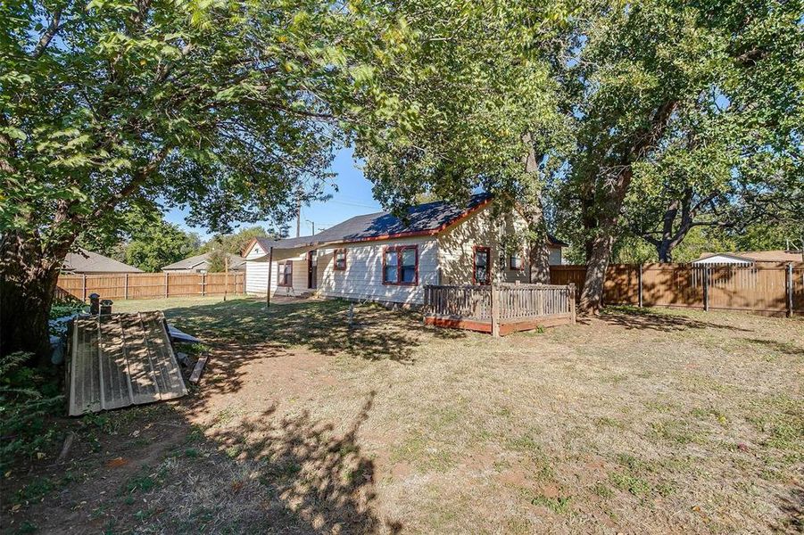 View of yard with a wooden deck