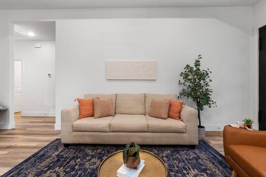 Living room with hardwood / wood-style floors