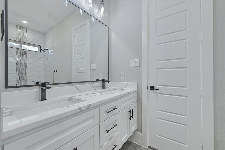 Bathroom featuring double sink vanity jack and Jill