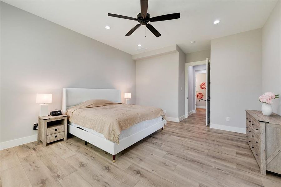 Bedroom featuring light wood-type flooring and ceiling fan