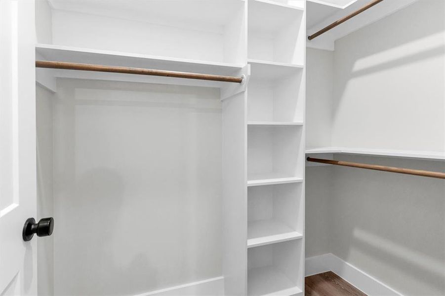 Third bedroom's walk-in closet with built-in shelving