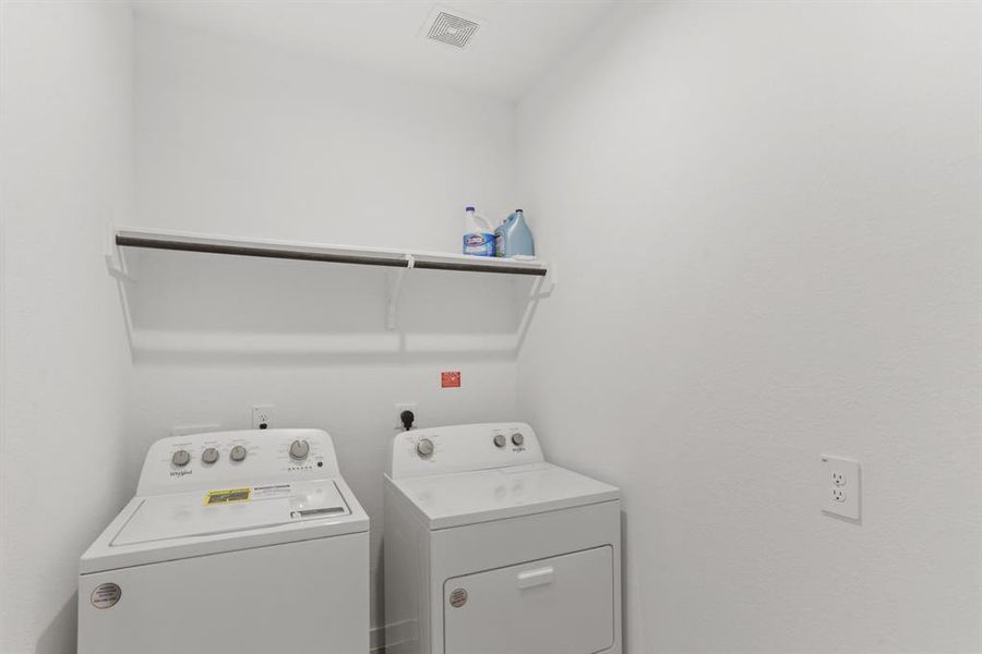 The utility room is so big, there is tons of space to create your own storage here.