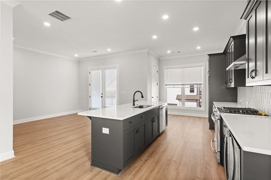 Sleek stainless appliances are a standard feature in the Grayton plan. NOT actual home. Photos of previously built Grayton floorplan.