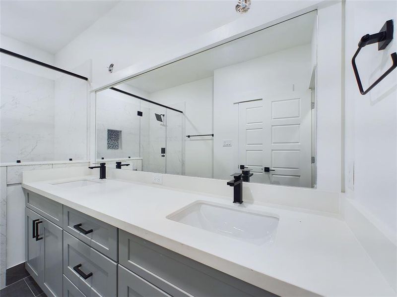 Primary bathroom with very spacious double sinks- model home photos