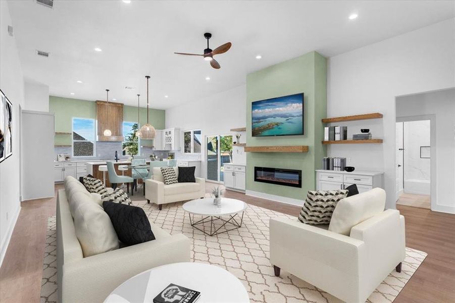 Living room featuring ceiling fan and light hardwood / wood-style flooring