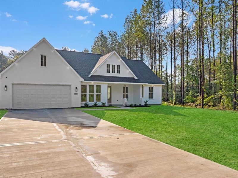 Step into this charming modern farmhouse with its inviting white brick exterior and welcoming porch. The oversized windows, under soffit lighting, and discreet security camera add both style and functionality to this beauty!
