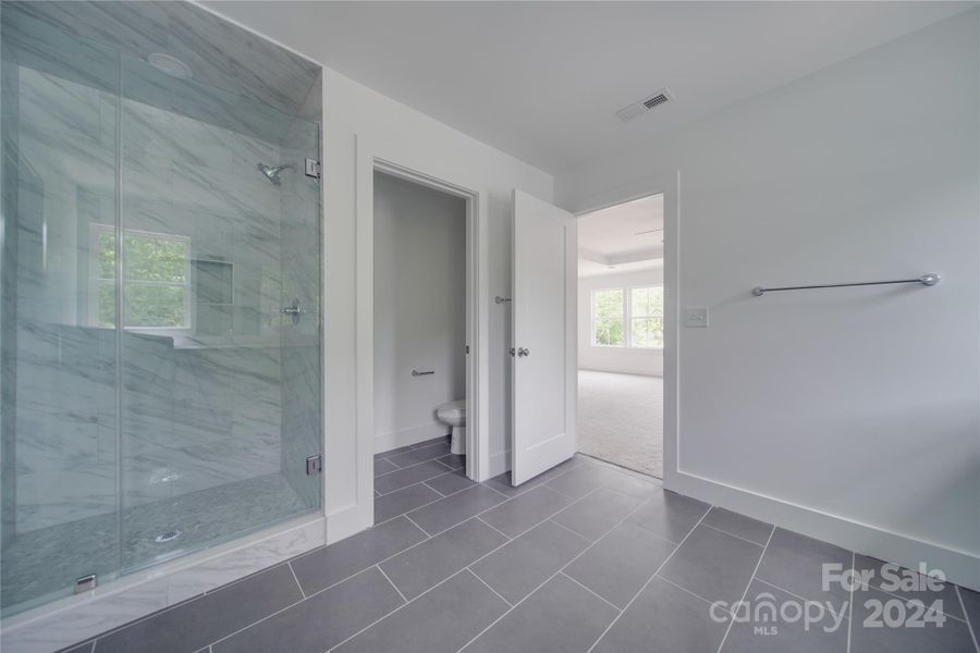 PRIMARY BATHROOM WITH UPGRADED WALK IN SHOWER