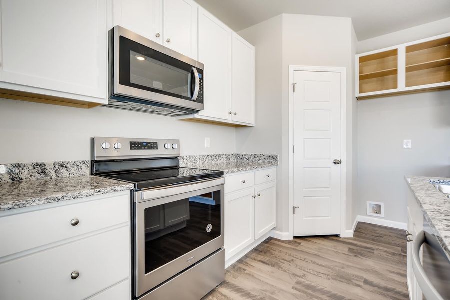 Kitchen counters and appliances of the Fraser floor plan by Century Communities