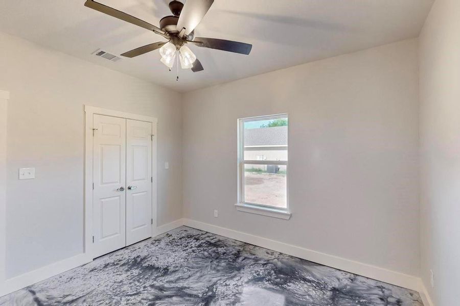 Empty room featuring ceiling fan