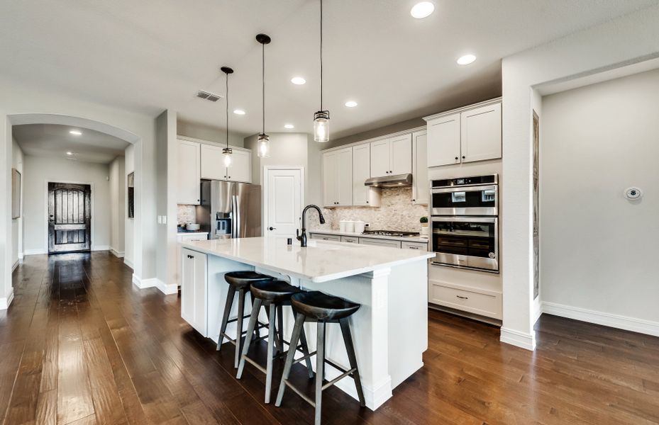 Spacious island kitchen with eat-in bartop