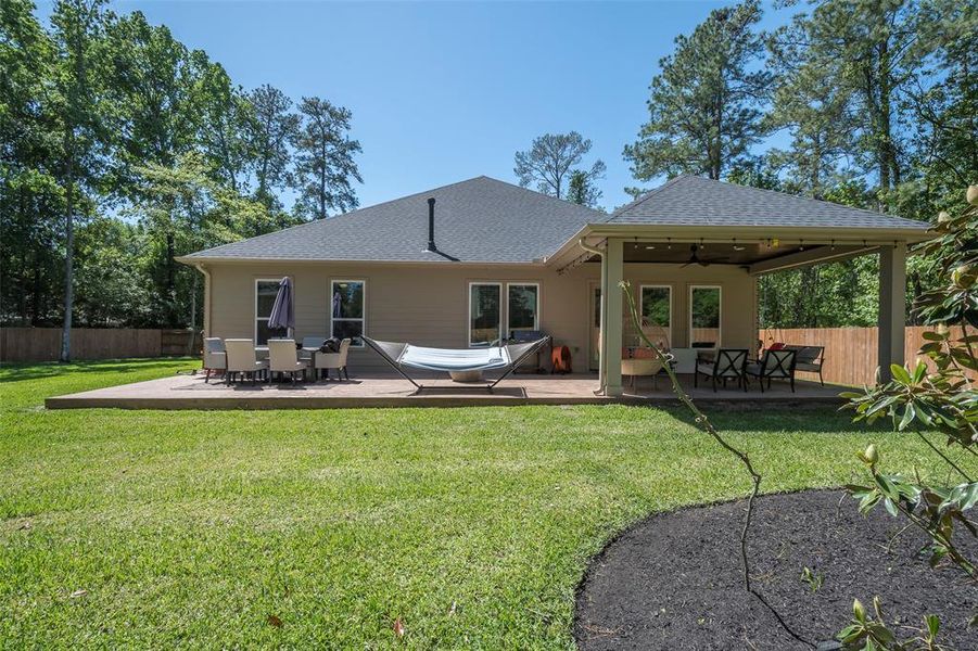 The outdoor living space here is amazing! The covered area is 20x14 and the uncovered area is 30x14 for a total of 700 square feet of custom stamped wood plank patio area. The ceiling is tongue and groove that is stained with a outdoor ceiling fan!