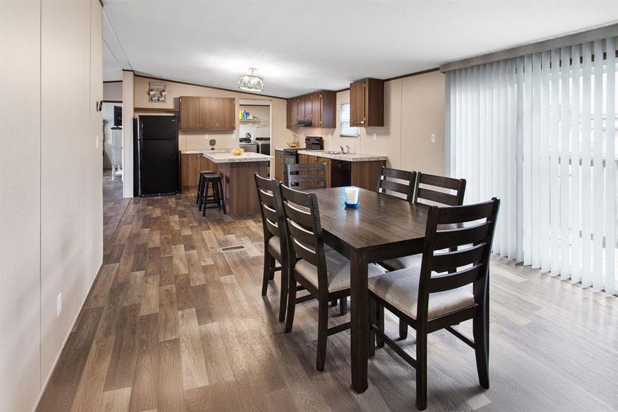 Adjacent to the kitchen, the Dining Area offers a delightful space for meals and gatherings.