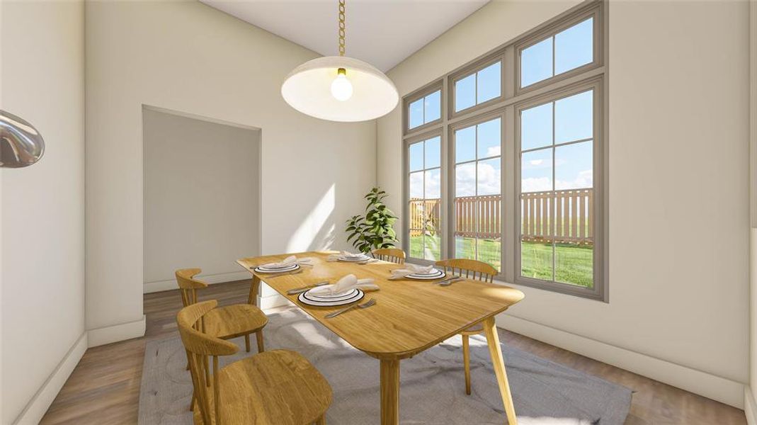 The breakfast nook, located just off the kitchen, offers abundant natural light, overlooks the backyard, and provides access to the covered patio.