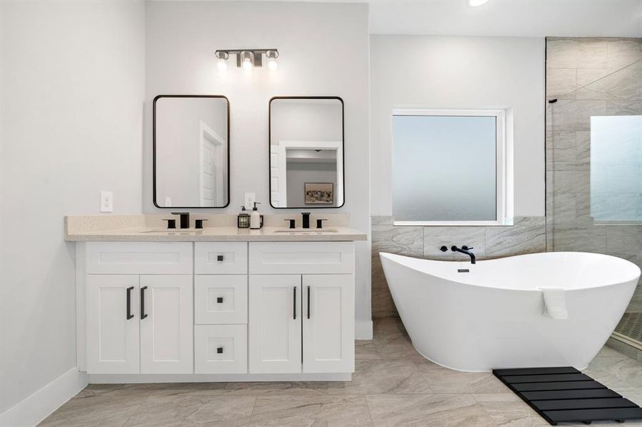 Bathroom accentuates refined luxury with a modern vanity setup and tranquil lighting, creating a spa-like environment.