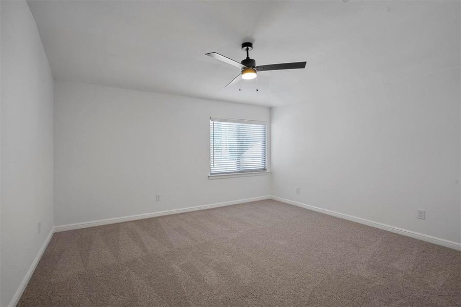 Unfurnished room with carpet flooring and ceiling fan