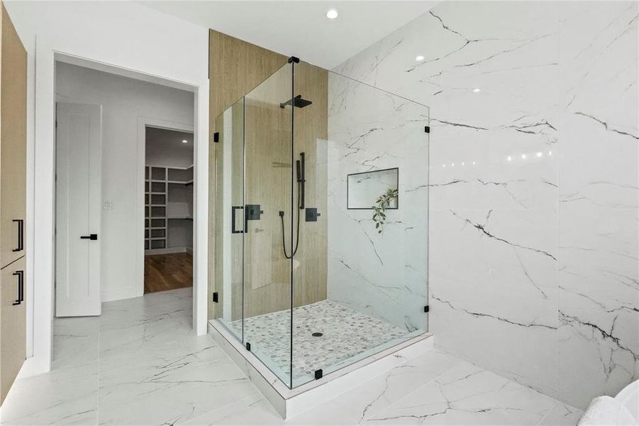 Bathroom featuring walk in shower