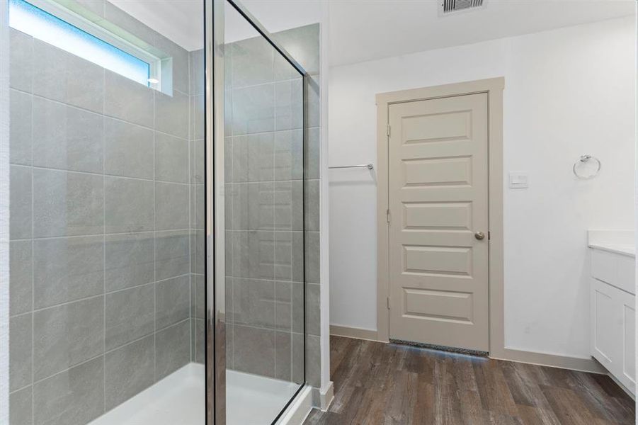 The Private Owner's Suite features a Luxurious Upgraded Bathroom with His & Her Undermount Sinks, Cultured Marble Countertop and Light Bathroom Shaker Cabinets! **Image Representative of Plan Only and May Vary as Built**