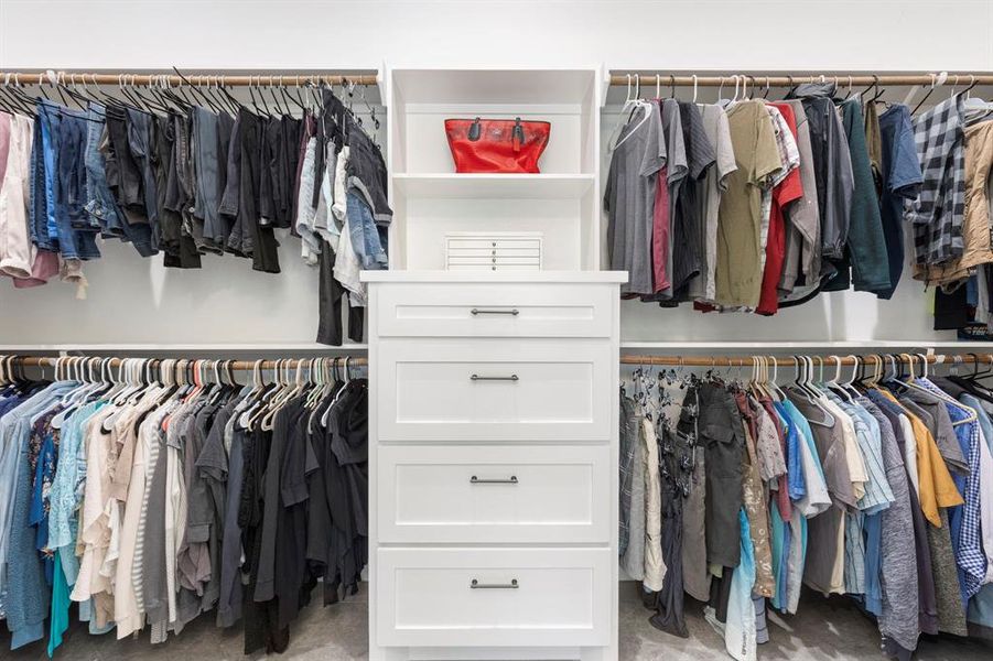 The primary bedroom closet is HUGE! With built-in drawers and plenty of hanging space for even the most gifted shoppers.