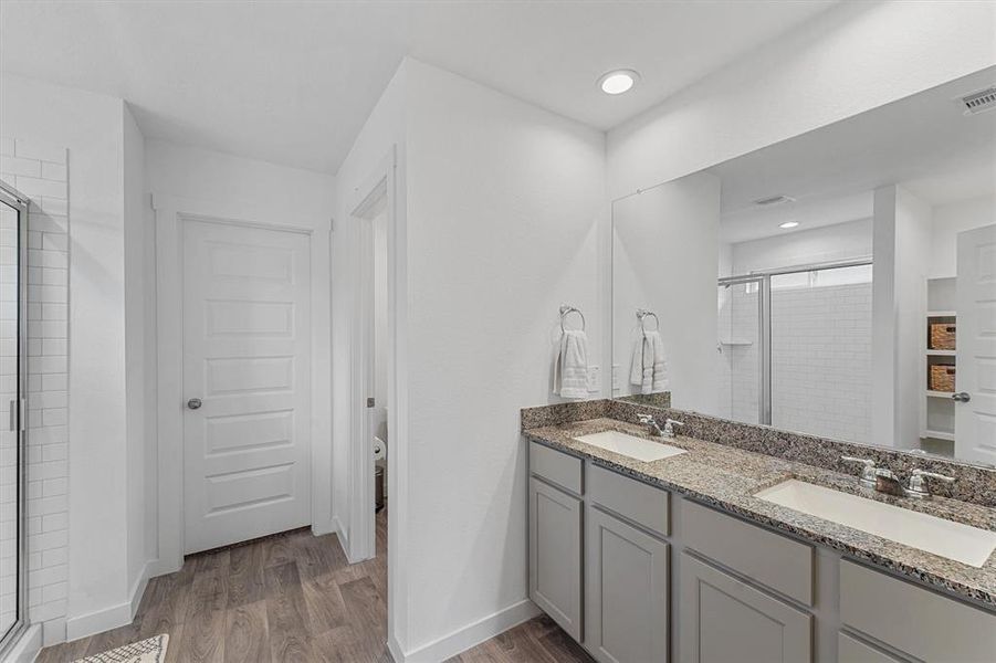 Primary bathroom with built in storage, soaking tub, double sinks and amazing shower!