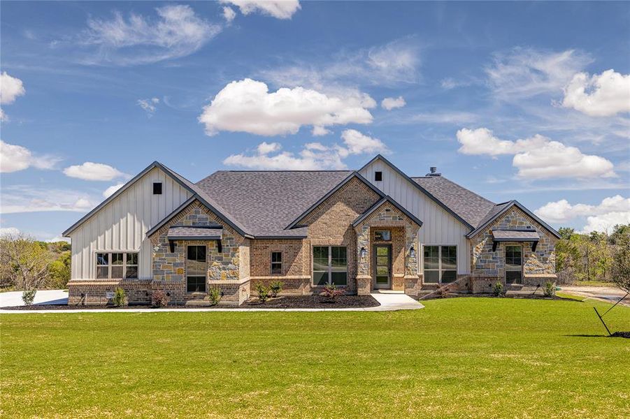 View of front of property featuring a front lawn