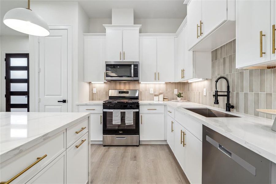 Experience modern convenience in this newly appointed kitchen, featuring brand-new stainless steel appliances that elevate your culinary adventures.