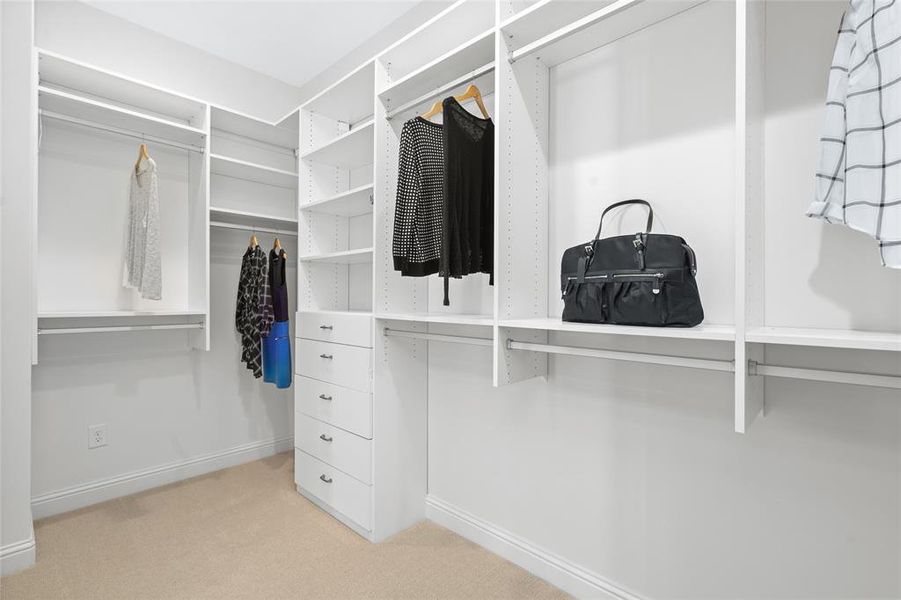 Spacious and masterfully crafted Primary Closet with ample storage and organizational capabilities. Photo is of an existing home & used for representative purposes only.