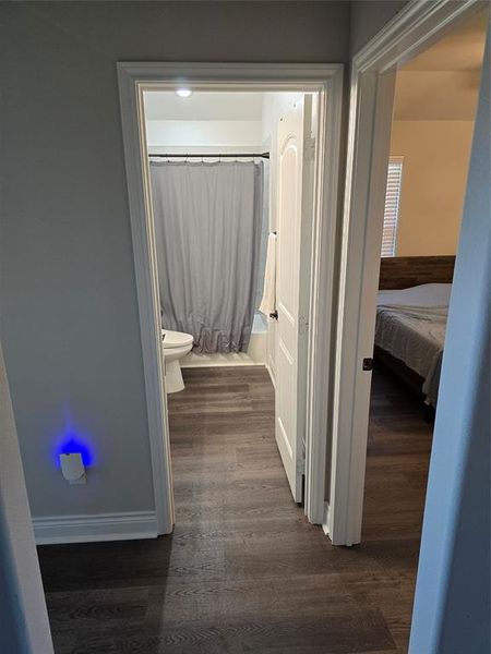 Corridor featuring dark hardwood / wood-style flooring