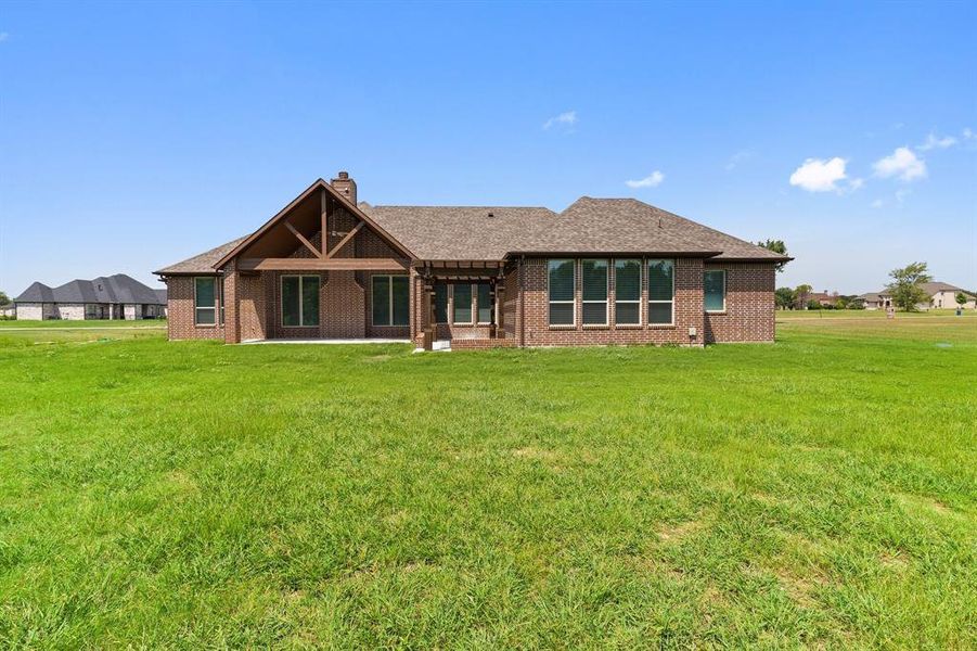 View of front of property with a front lawn