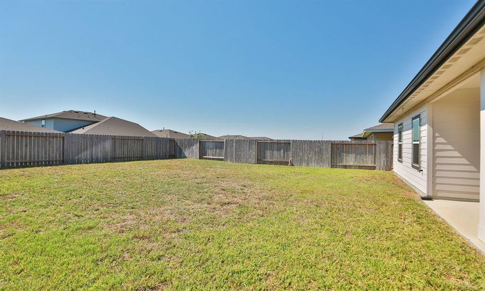 Pool size back yard for putting in a pool or play equipment for children.