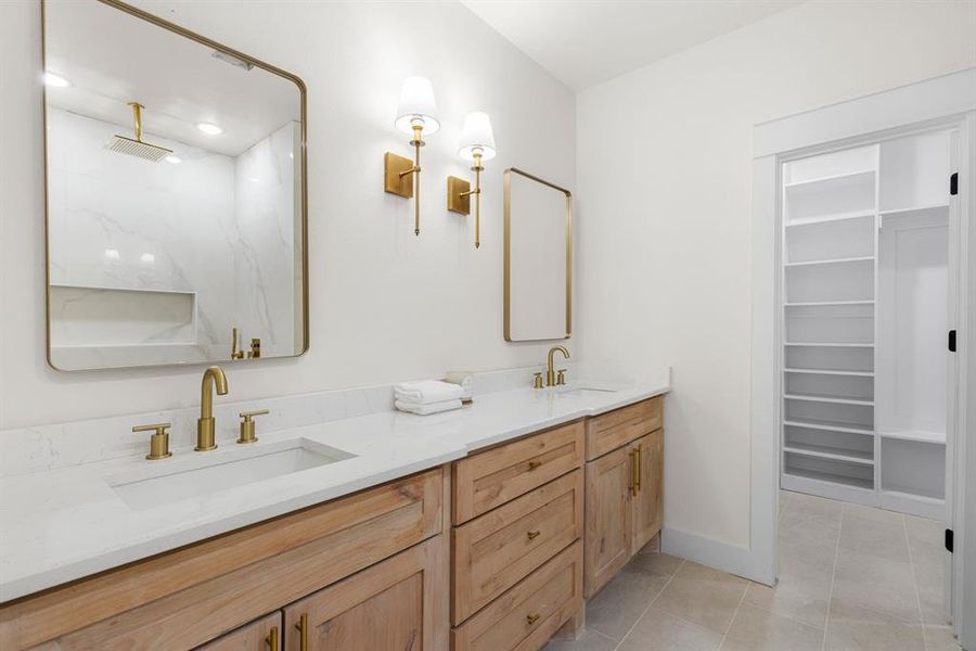 Bathroom featuring dual vanity and tile patterned floors