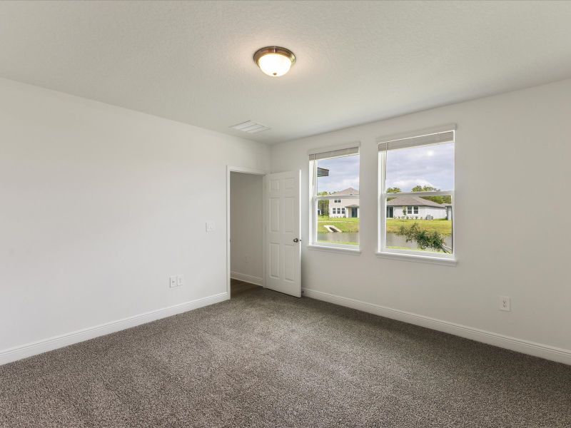 Primary bedroom in the Everglade floorplan at 209 Links Terrace Blvd