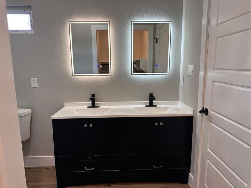 Mirrors with adjustable brightness and anti-fog buttons.