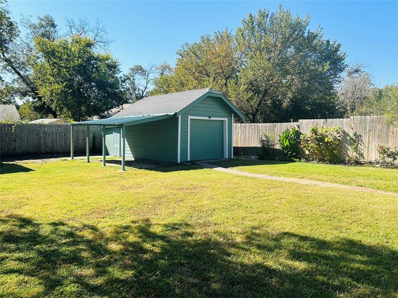 Garage, located in the back of the yard.