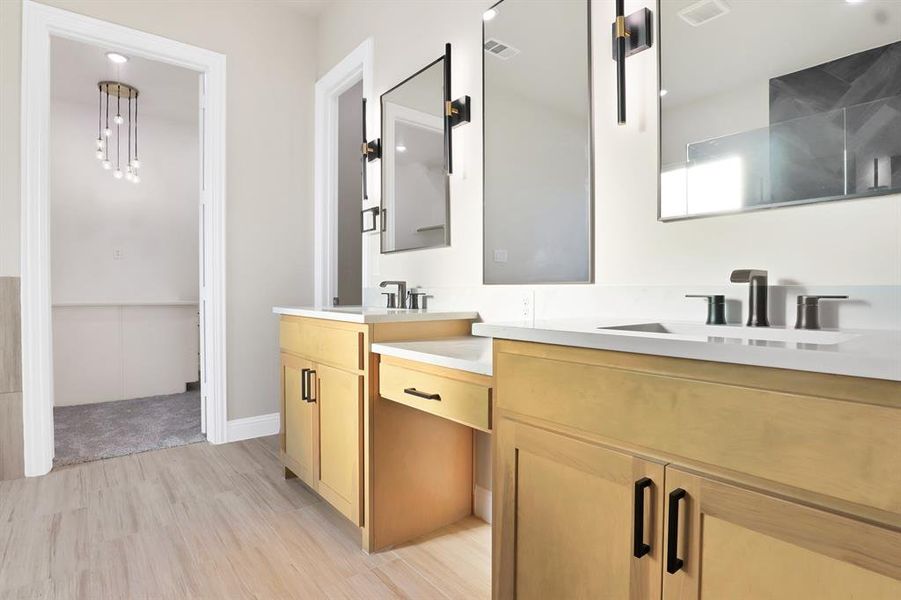 Bathroom with vanity and wood-type flooring