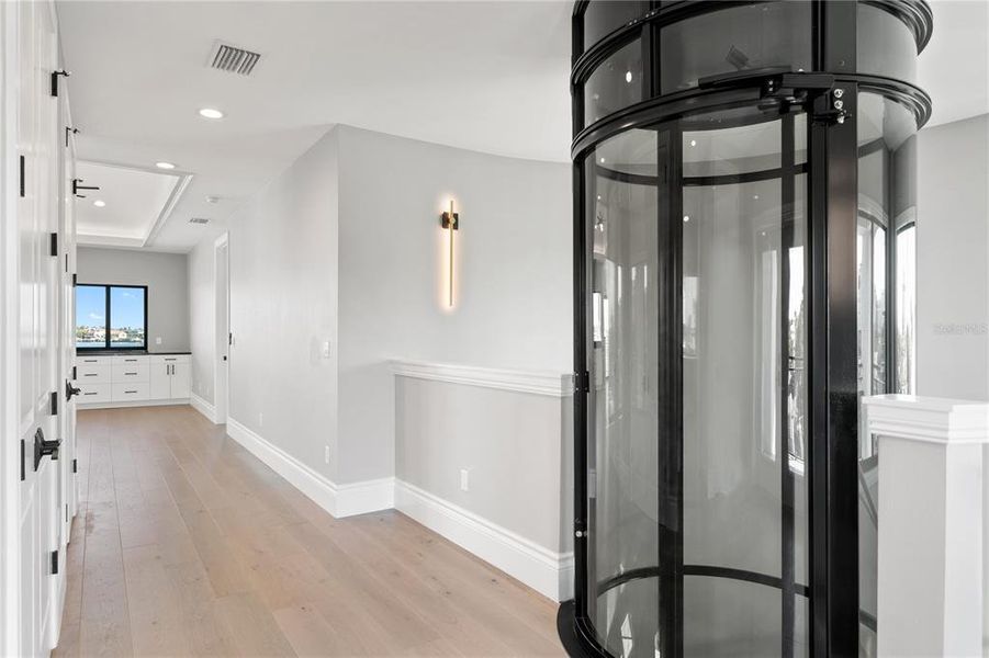 3rd level family room entrance from clear circular elevator