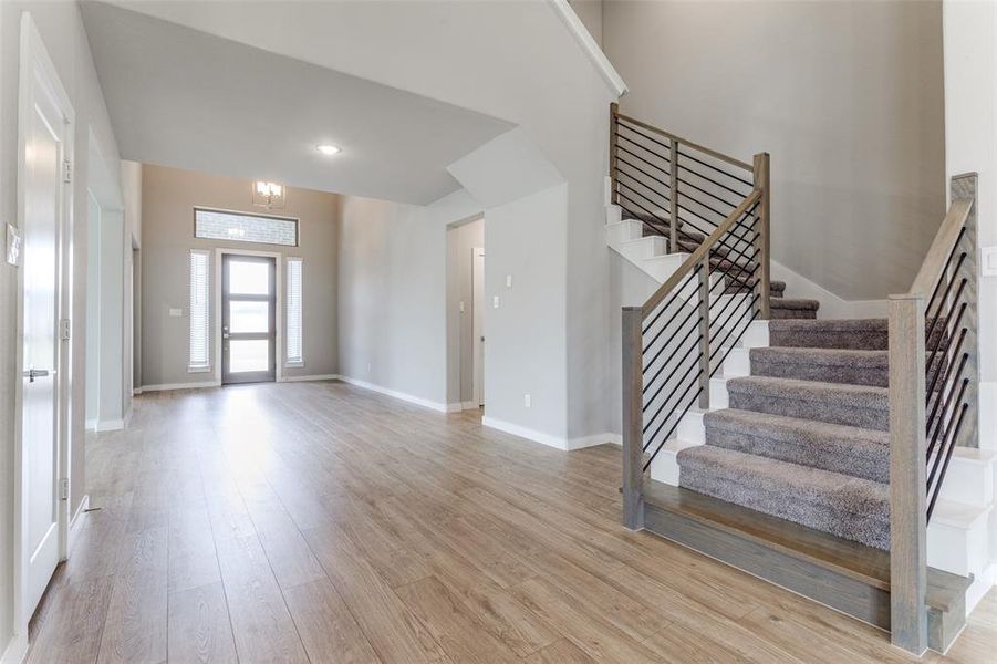 Unfurnished living room with light wood-type flooring