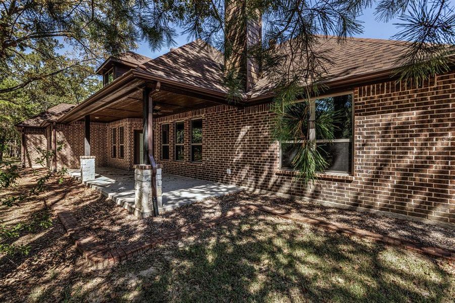 Back of house with a patio area