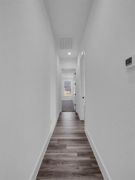 Hall featuring dark hardwood / wood-style floors