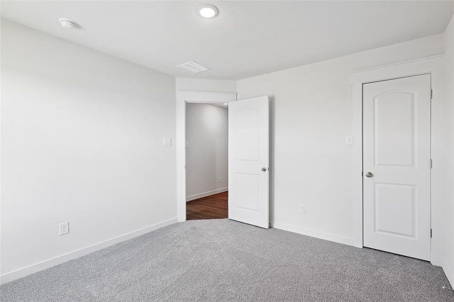 Unfurnished bedroom featuring carpet floors