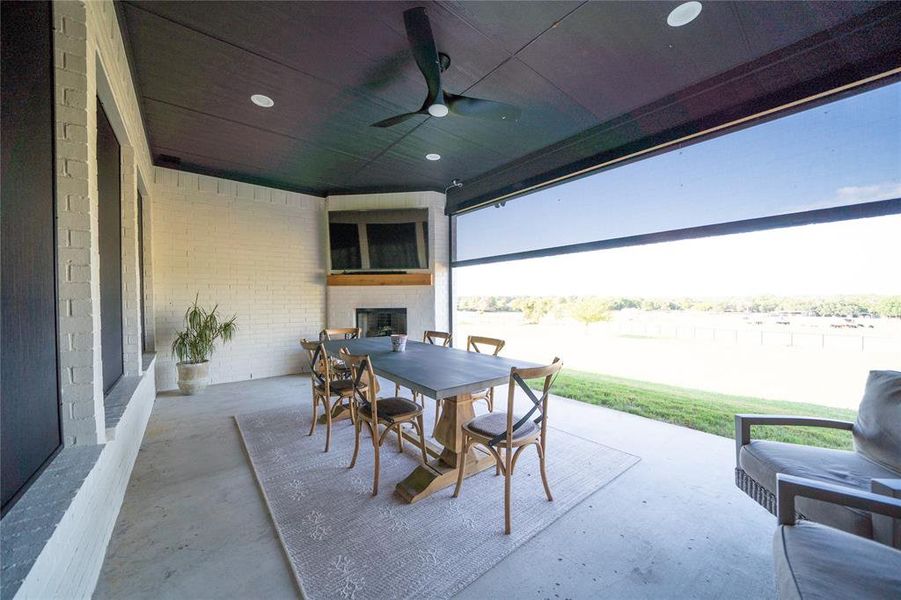 View of patio featuring ceiling fan