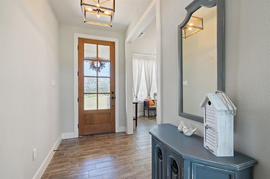 Entryway featuring dark wood-type flooring