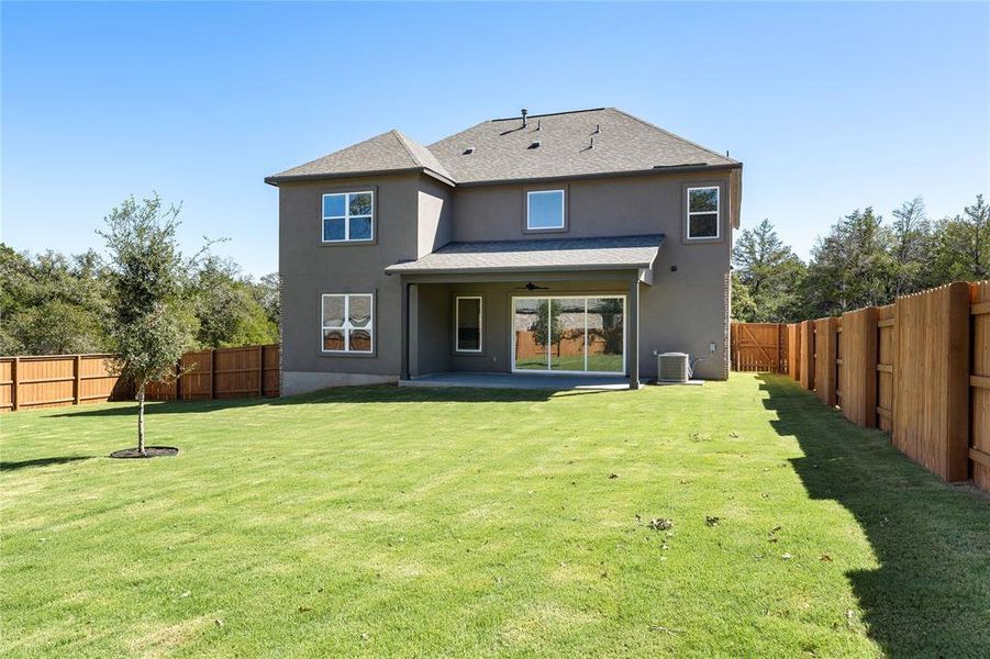 Backyard is securely fenced in for privacy.