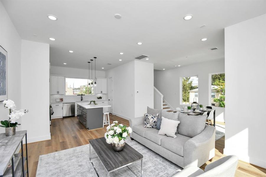 Living room open to kitchen and dining area