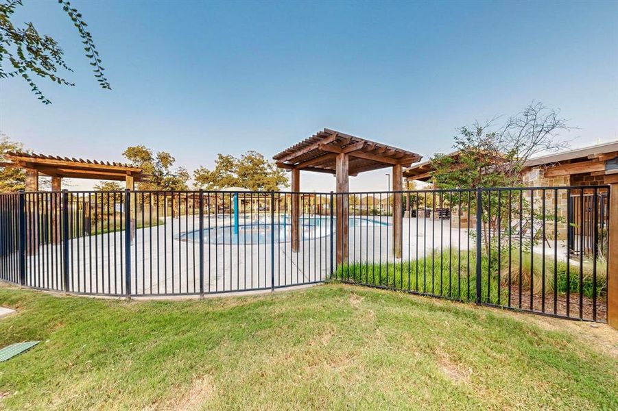 View of community pool and pergola