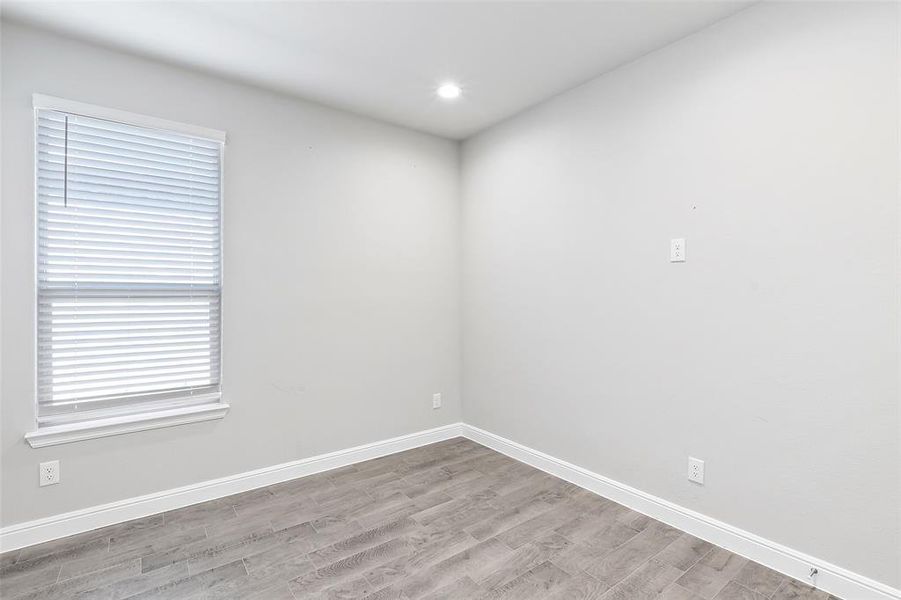 Spare room with light wood-type flooring