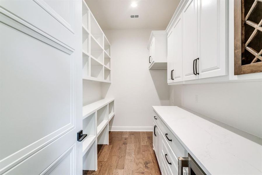 Walk in closet featuring light hardwood / wood-style floors