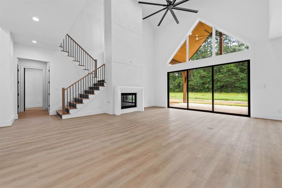 Two story living room/gas fireplace, sliding doors to back patio.