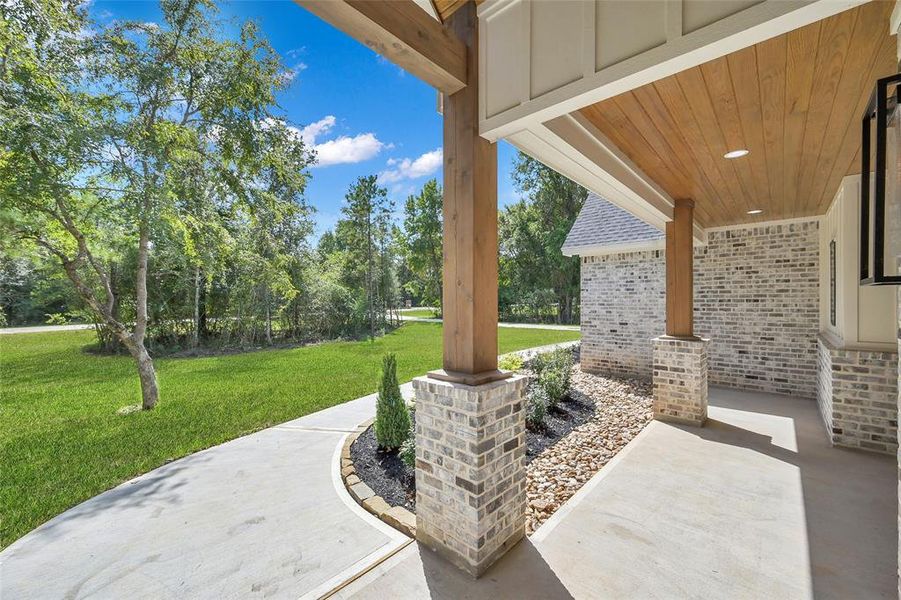 Front covered porch area solid cedar beams