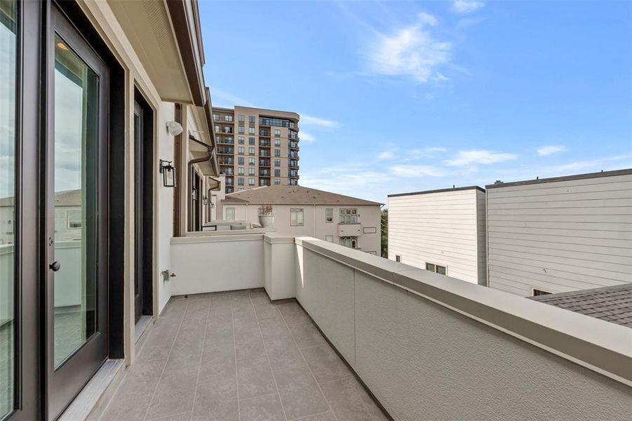 The house features a rear balcony that offers a great place to relax after a long day!